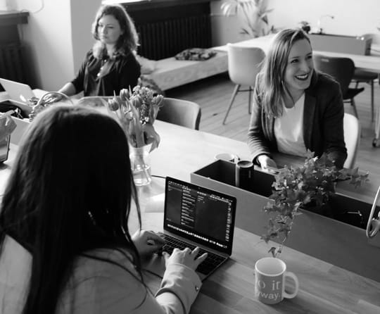 Ladies working happily in the office.