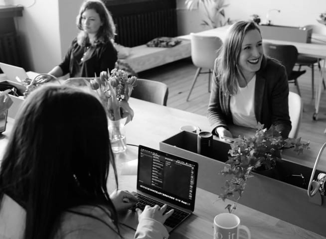 Ladies working happily in the office.